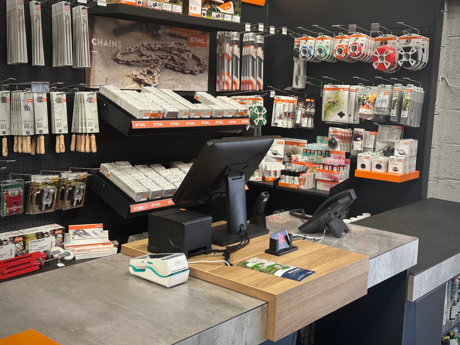 MD Burke's trade counter in Cashel, with the touchscreen till and card terminal in use.